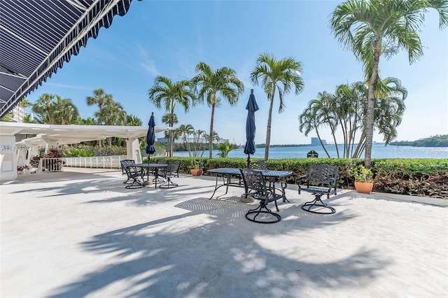 view of patio with a water view