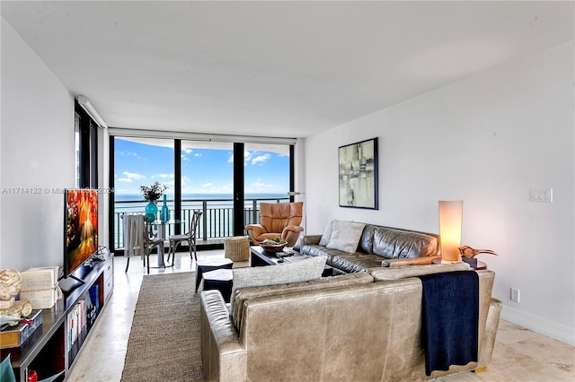 living room featuring floor to ceiling windows