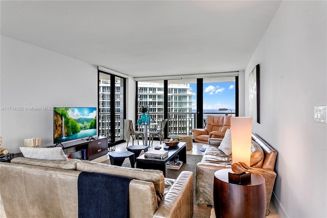 living room featuring floor to ceiling windows