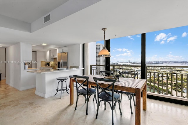 dining room with expansive windows