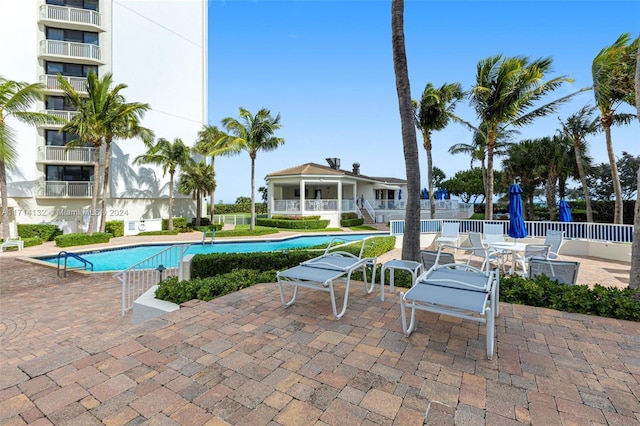 view of swimming pool featuring a patio area