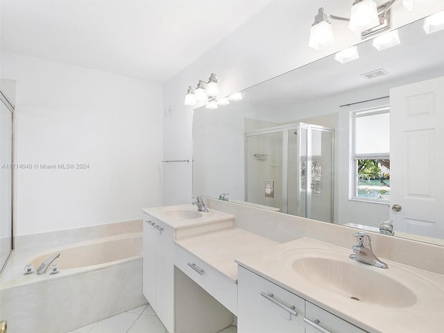 bathroom featuring vanity, tile patterned floors, and separate shower and tub