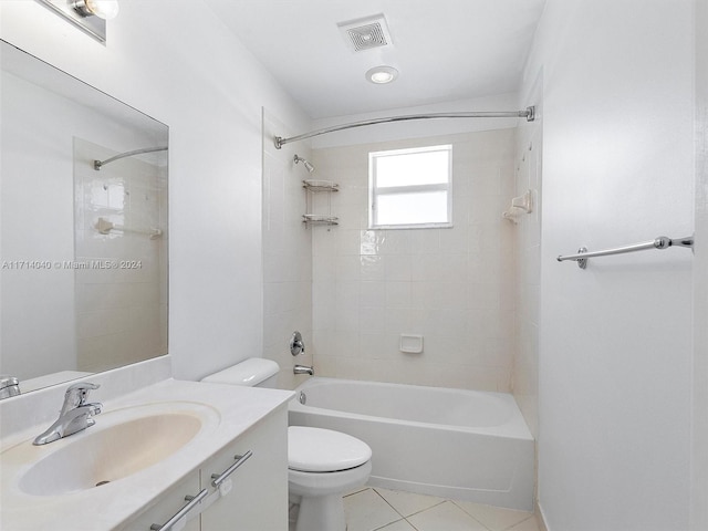 full bathroom with tile patterned flooring, vanity, toilet, and tiled shower / bath