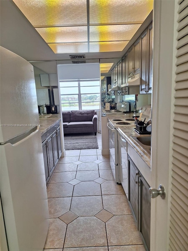 kitchen featuring sink and white appliances