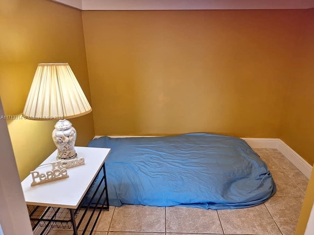 bedroom with tile patterned floors