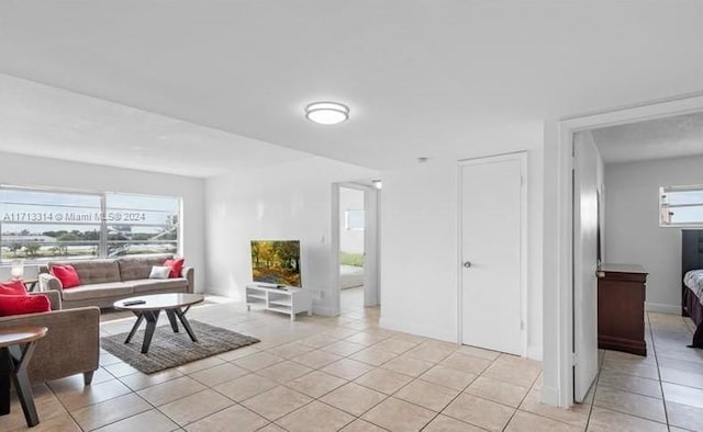 living room with light tile patterned flooring