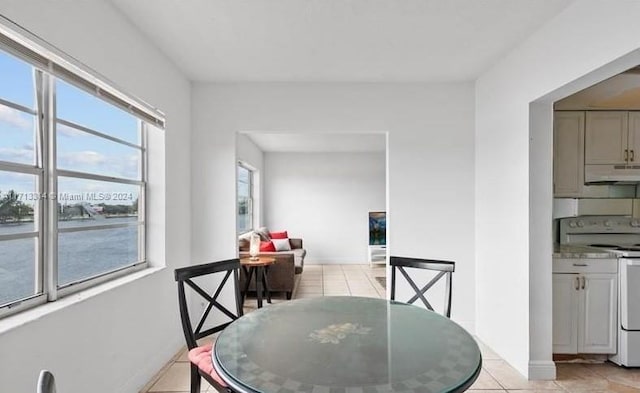 dining space with light tile patterned floors