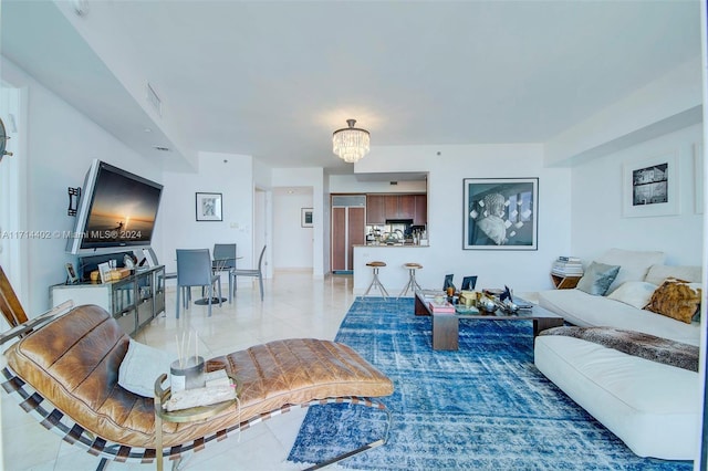 living room featuring a notable chandelier