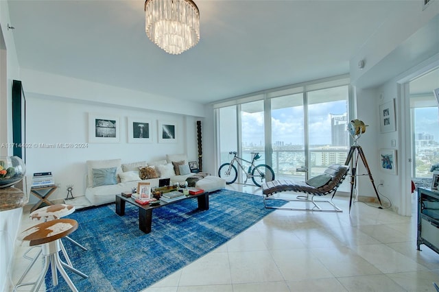 living room featuring light tile patterned floors, an inviting chandelier, and floor to ceiling windows