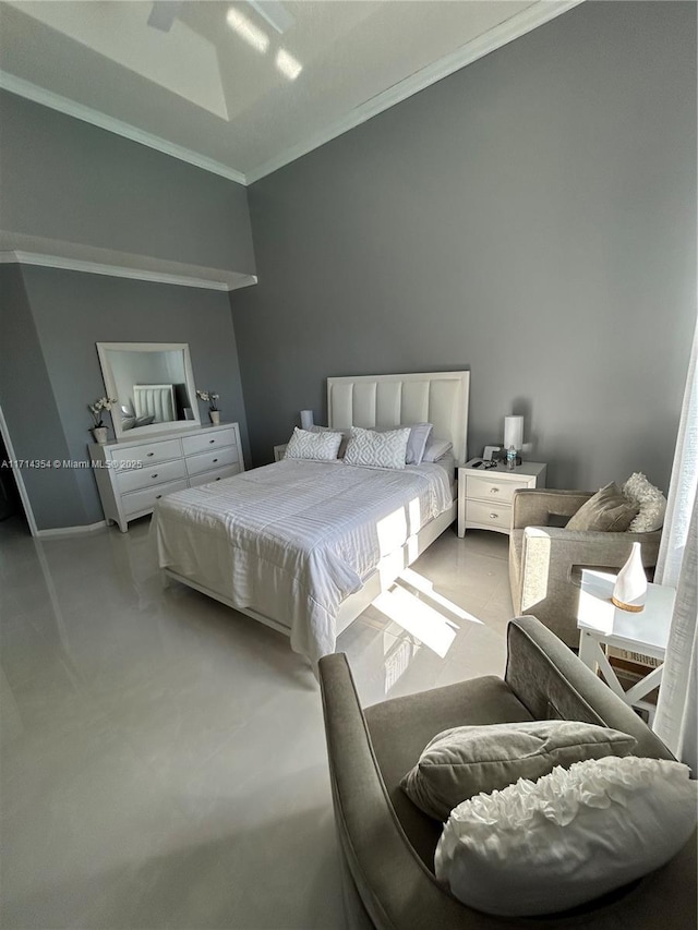 bedroom featuring baseboards and crown molding