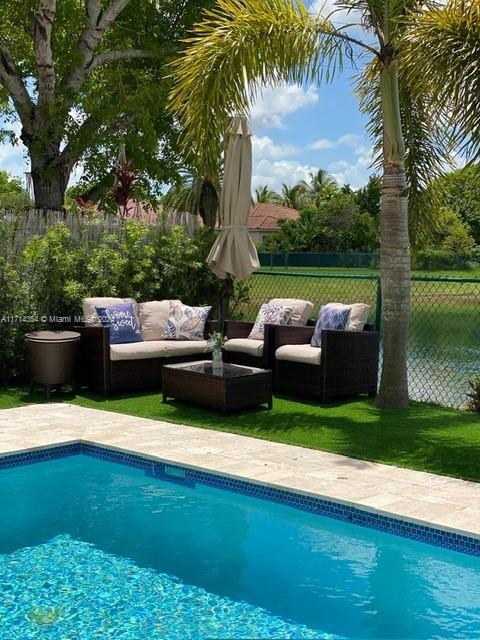 view of pool with an outdoor living space