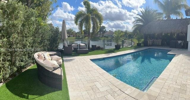 outdoor pool featuring a patio area