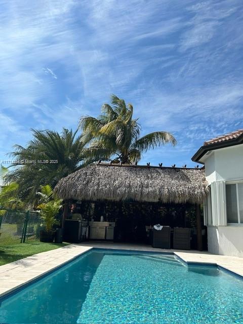 view of patio with outdoor lounge area and a gazebo