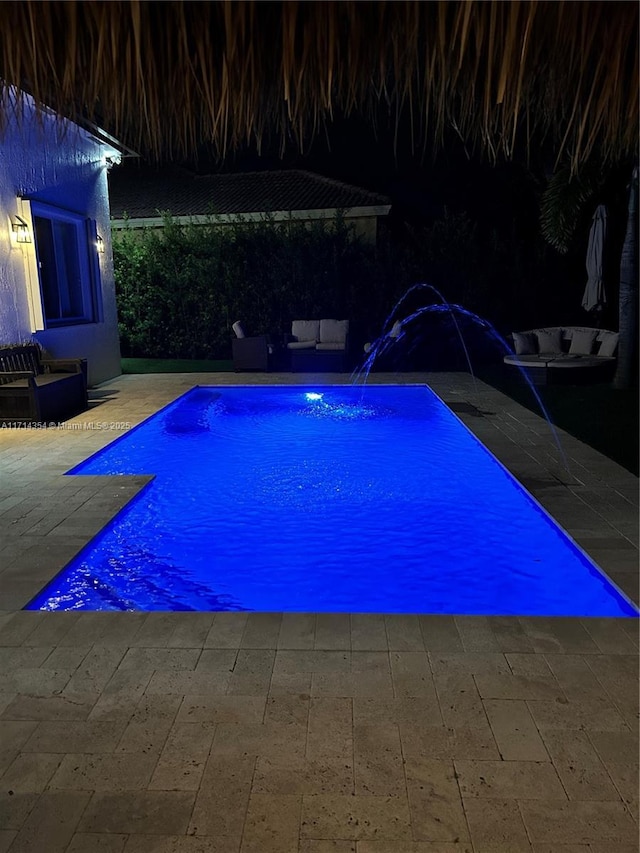 view of swimming pool featuring a patio area and a fenced in pool