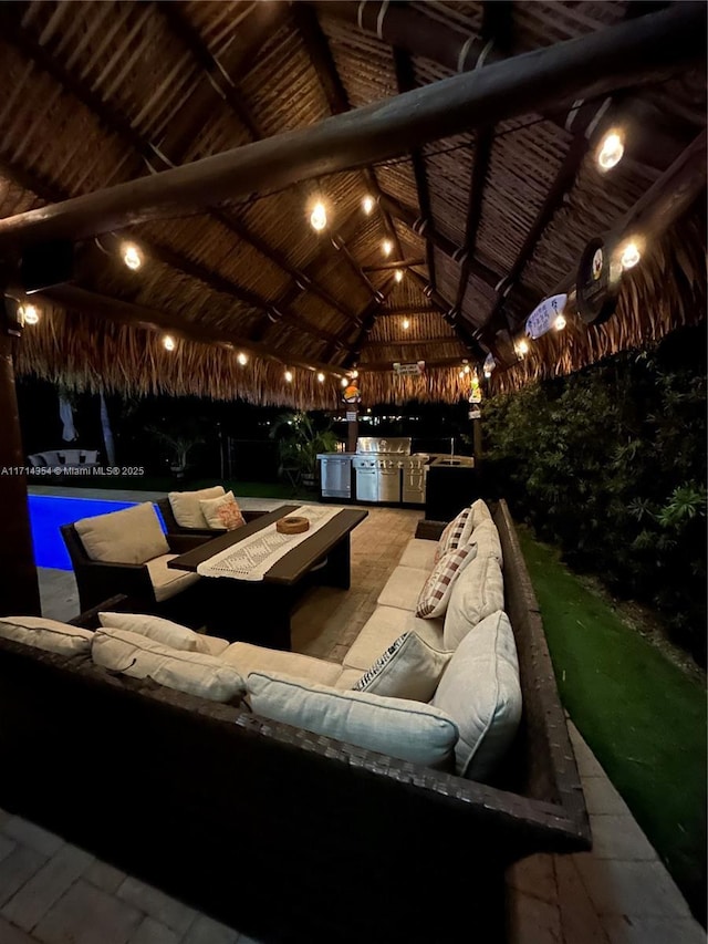 home theater room featuring wood ceiling and high vaulted ceiling