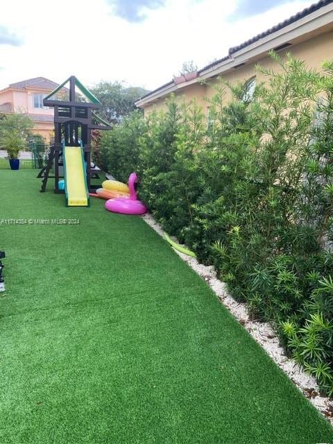 view of playground featuring a yard