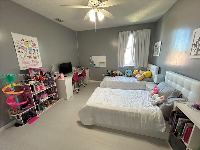 bedroom featuring a ceiling fan, visible vents, light carpet, and baseboards