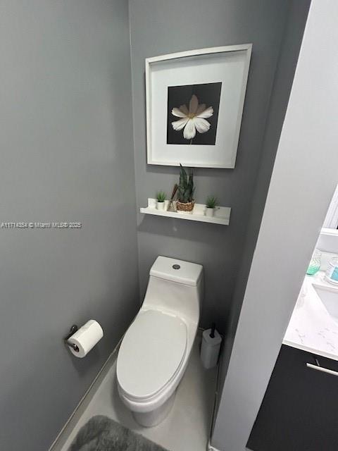 bathroom with vanity and toilet