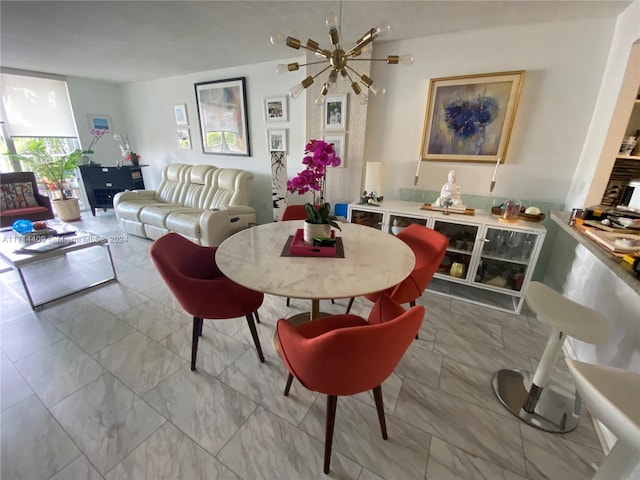 dining space with a notable chandelier