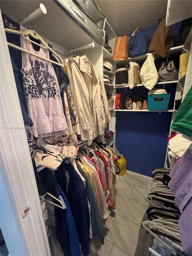 walk in closet featuring tile patterned floors