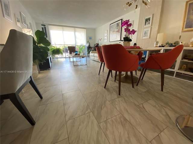 dining room featuring floor to ceiling windows