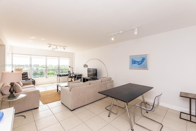 living room featuring light tile patterned floors and rail lighting