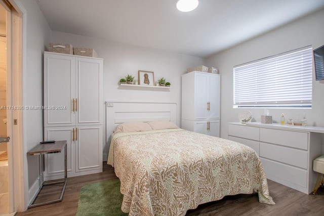 bedroom featuring dark hardwood / wood-style floors