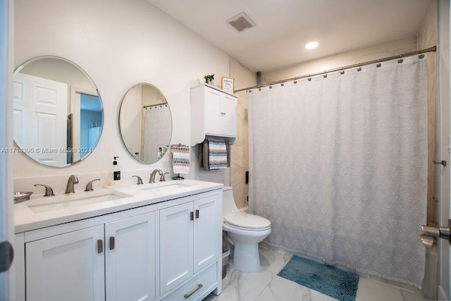 bathroom featuring vanity, a shower with shower curtain, and toilet