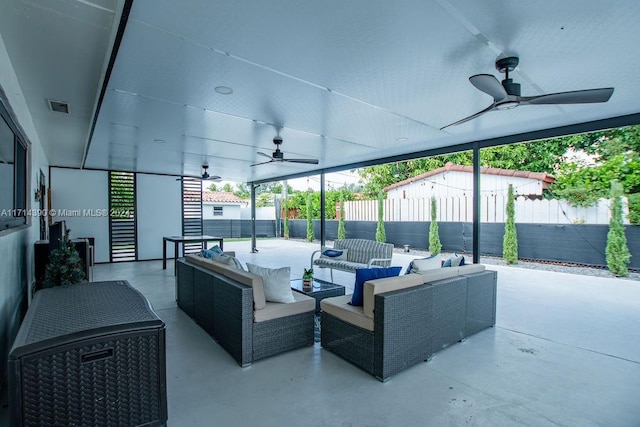 view of patio featuring an outdoor living space and ceiling fan