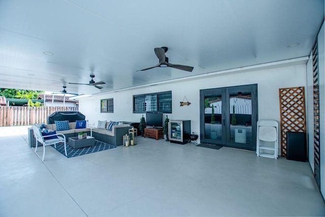 view of patio with outdoor lounge area, ceiling fan, and french doors