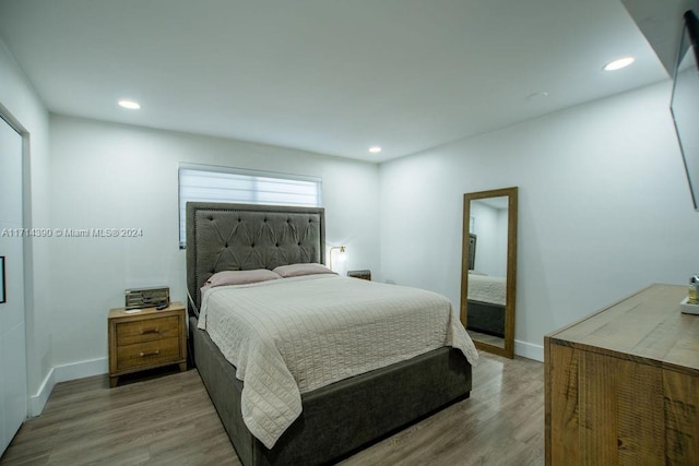 bedroom featuring hardwood / wood-style floors