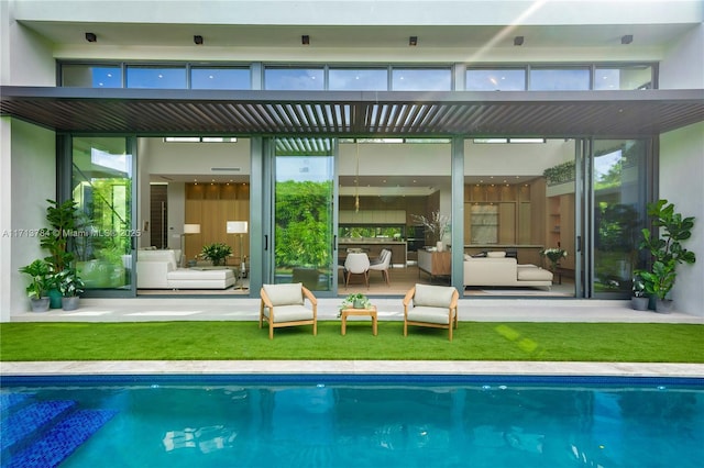 rear view of house with an outdoor living space