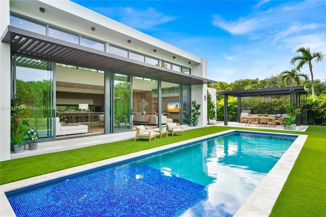 view of pool with a yard