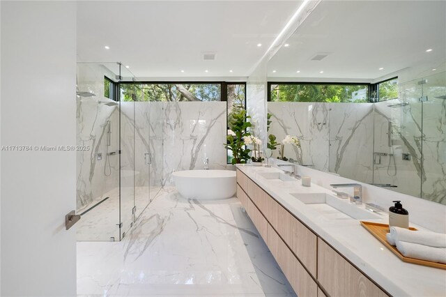 bathroom featuring vanity and plus walk in shower