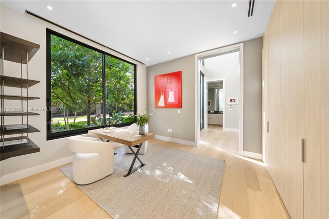 unfurnished room with light wood-type flooring