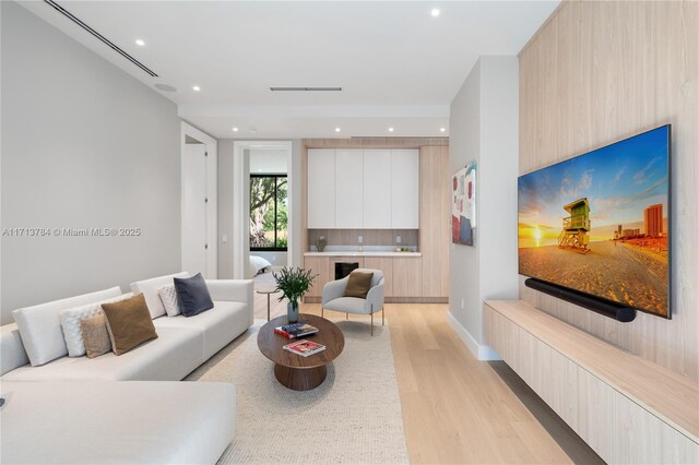 living room with light hardwood / wood-style flooring