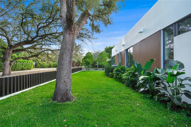 view of patio featuring a grill, ceiling fan, and exterior kitchen