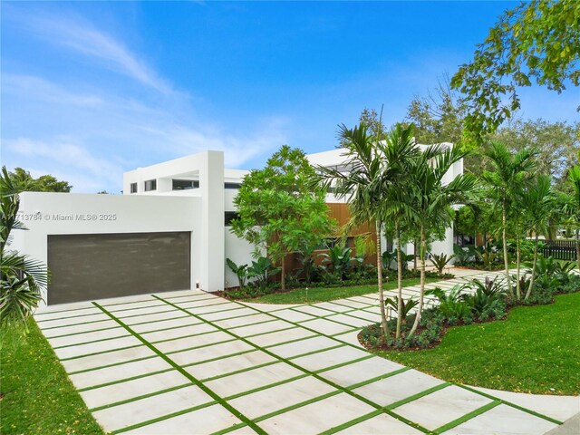 rear view of property featuring a yard and a patio area