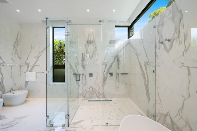 bathroom with a bidet, separate shower and tub, and a wealth of natural light