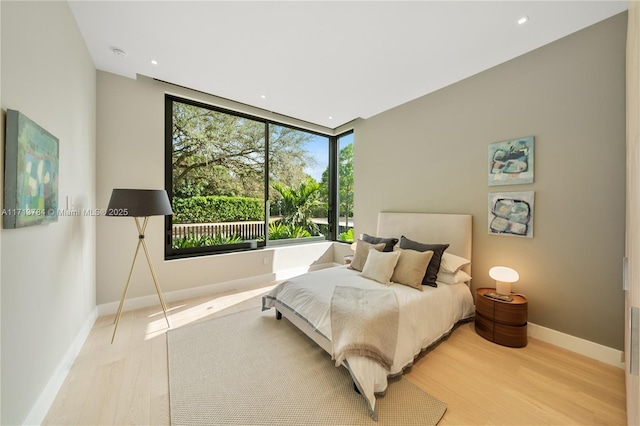 bedroom with light wood-type flooring