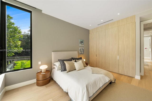 bedroom with light hardwood / wood-style flooring