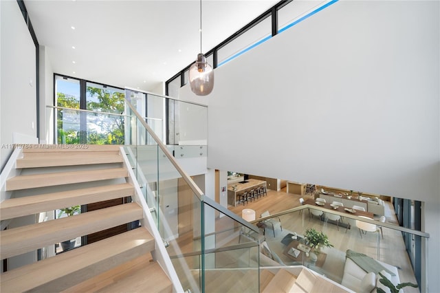 stairs featuring hardwood / wood-style floors