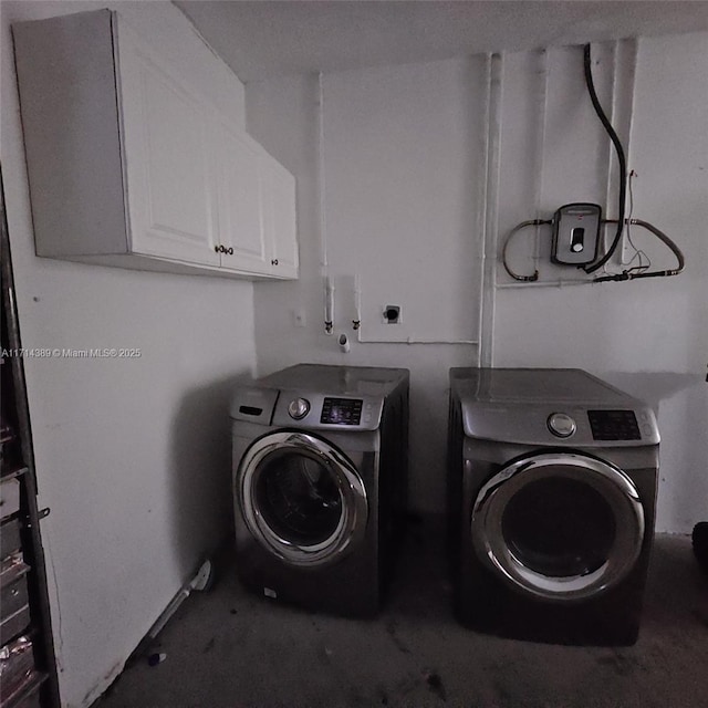 laundry area featuring cabinet space and washer and dryer