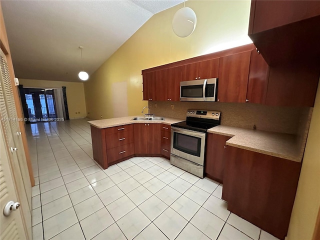 kitchen with stainless steel appliances, vaulted ceiling, tasteful backsplash, and pendant lighting