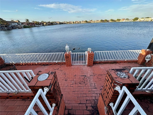 view of patio / terrace featuring a water view