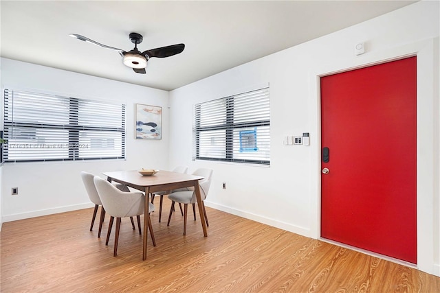 dining room featuring ceiling fan and light wood-type flooring