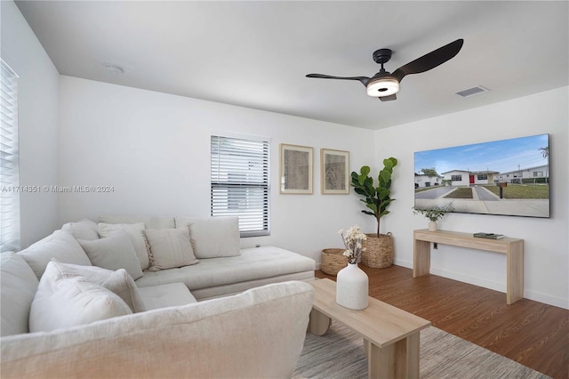 living room with hardwood / wood-style floors and ceiling fan