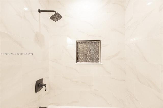 details featuring a tile shower