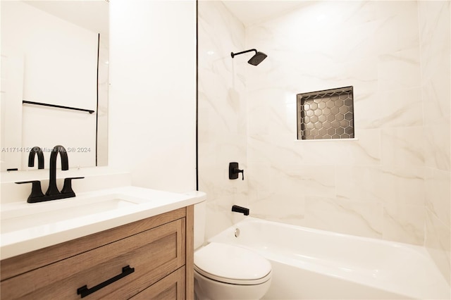 full bathroom with vanity, tiled shower / bath combo, and toilet