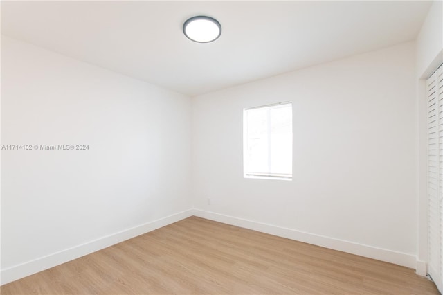 spare room with light wood-type flooring